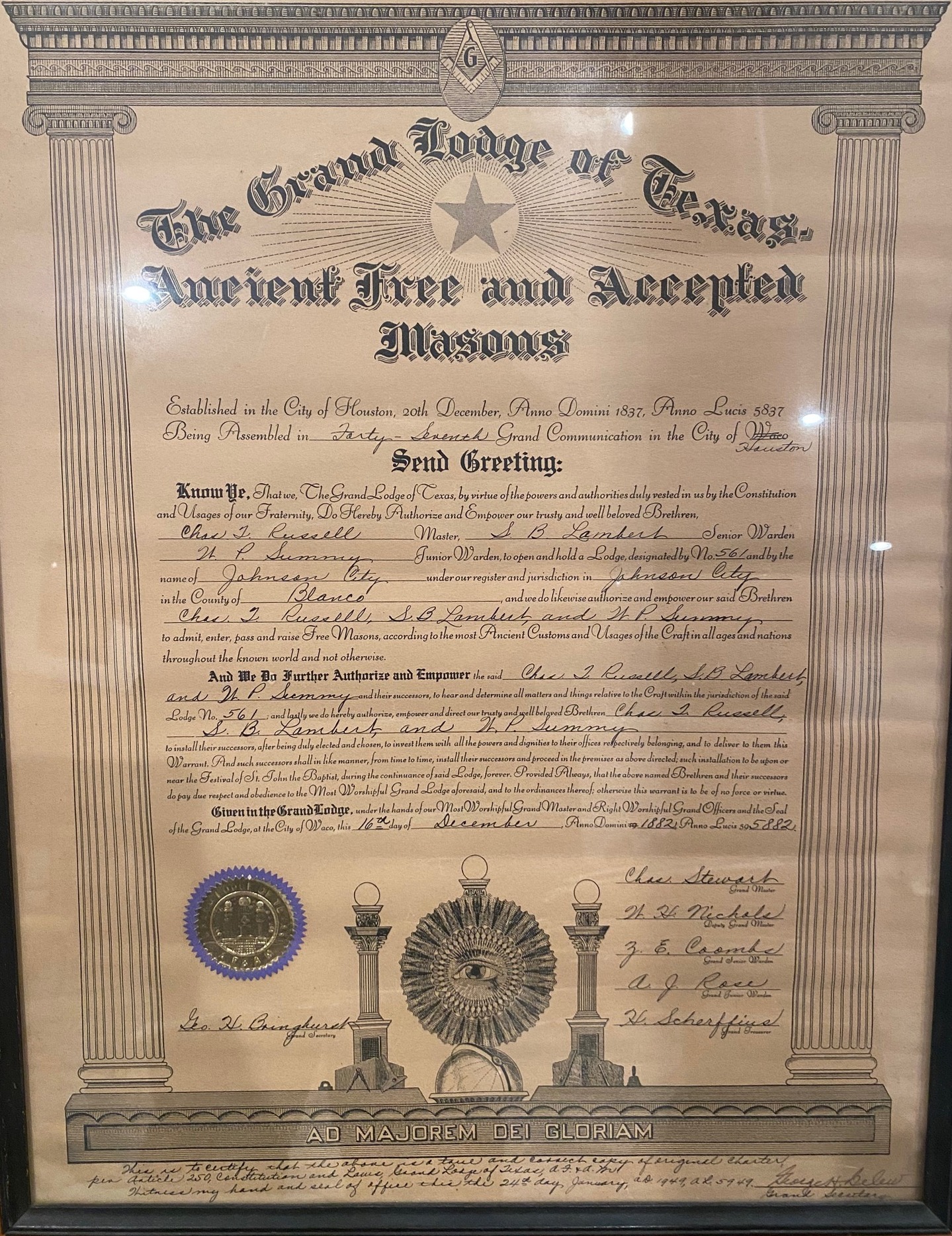 The original 1882 charter of Johnson City Lodge No. 561, granted by the Grand Lodge of Texas, Ancient Free and Accepted Masons. Framed parchment document with the Grand Lodge seal.