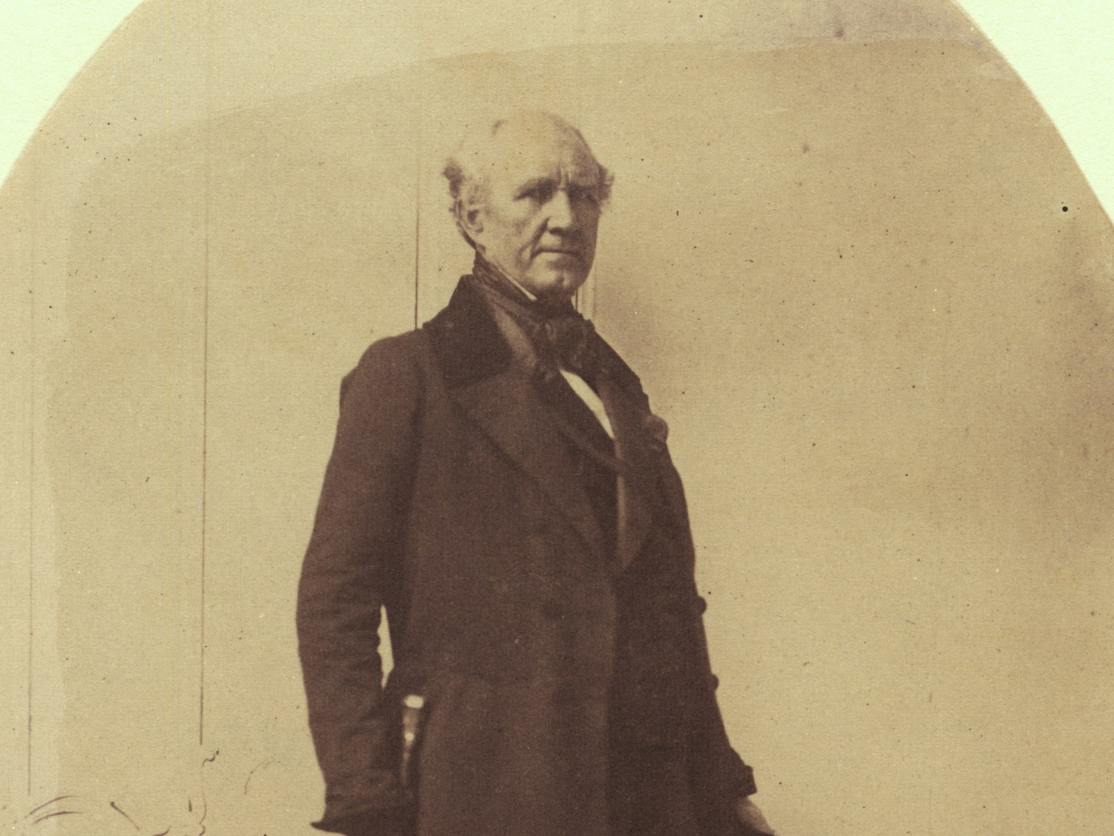 Sam Houston in 1856, shown from the knees up in a dark frock coat, standing and facing right, in a detail from a Library of Congress photograph.